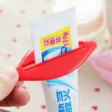 2pcs exprimidor de crema del tubo del producto de limpieza del tratamiento facial del dosificador de la pasta de dientes del cuarto de baño de beso del labio